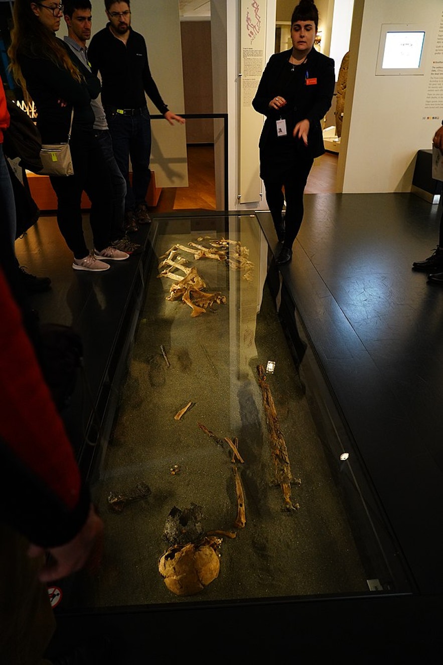 A tour guide with group at the National Museum of Iceland