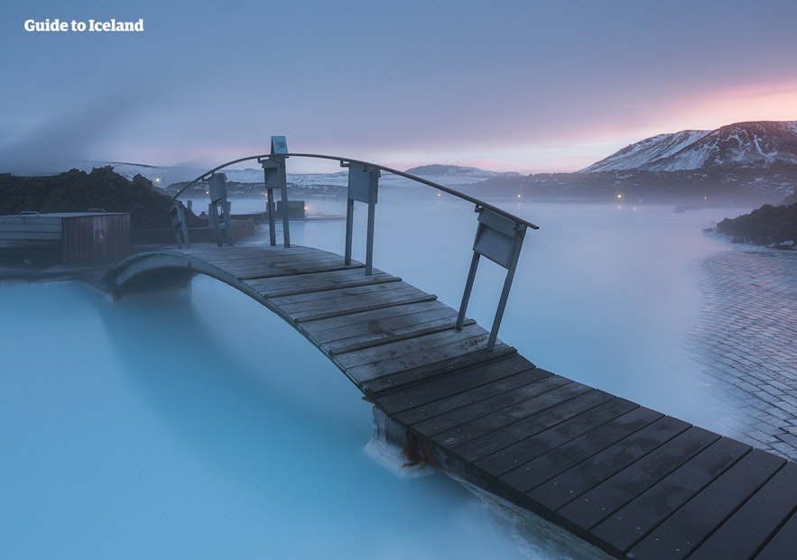 A bridge leads over the milky waters of the Blue Lagoon.