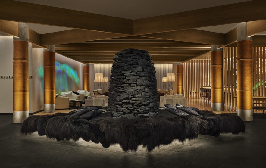 The lobby of the EDITION Reykjavik, featuring a striking sculpture.