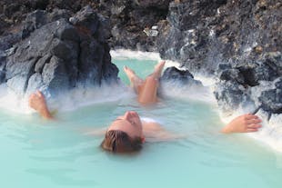 A woman relaxes in the Blue Lagoon geothermal spa.