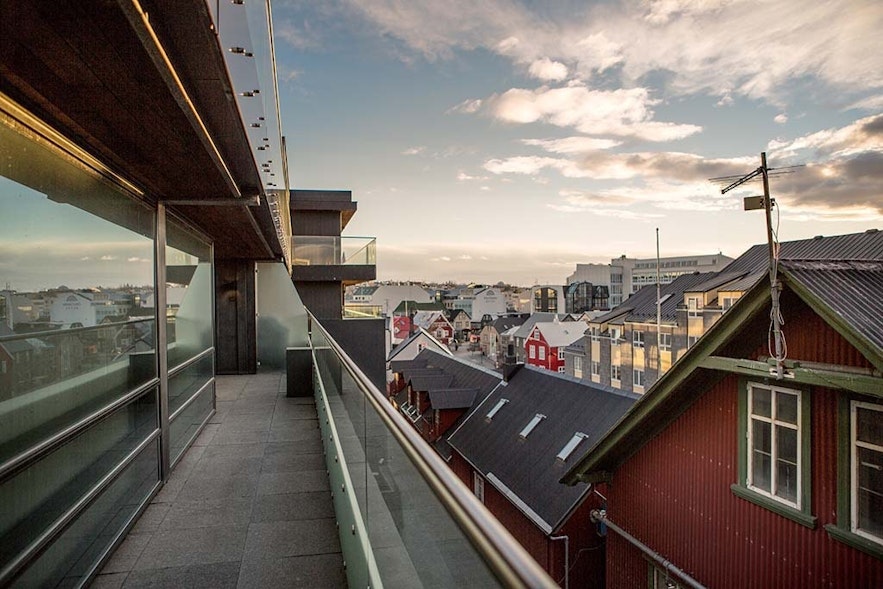 The balcony of the Penthouse Suite at the Black Pearl in Reykjavik, with beautiful views of the cityscape.
