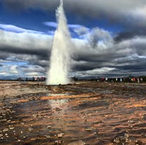 Watch the Strokkur geyser shoot superheated waters in the Golden Circle.