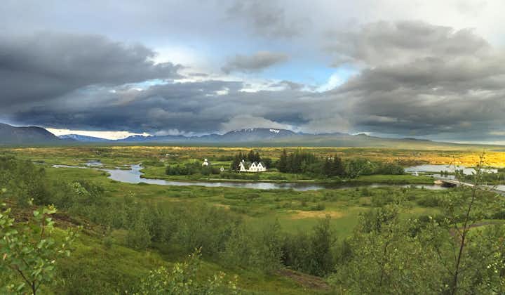 The tranquil Oxara River flows through the scenic Thingvellir National Park in Iceland.
