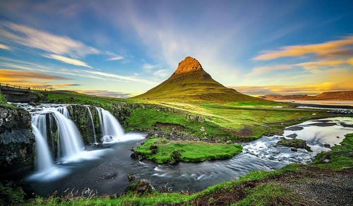Kirkjufell mountain is teeming with vegetation during spring and summer seasons in Iceland.