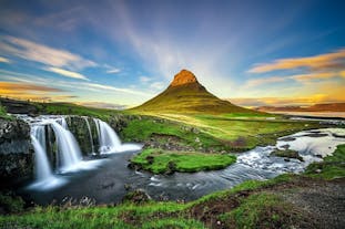 Kirkjufell mountain is teeming with vegetation during spring and summer seasons in Iceland.