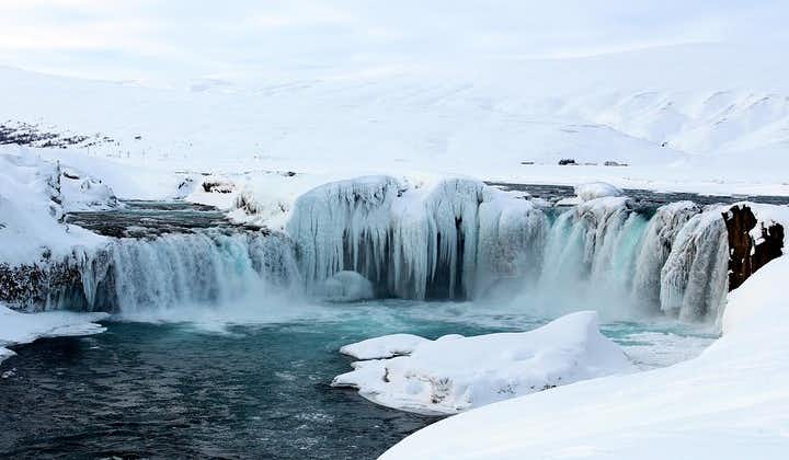 Godafoss waterfall transforms into an icy wonderland during winter.