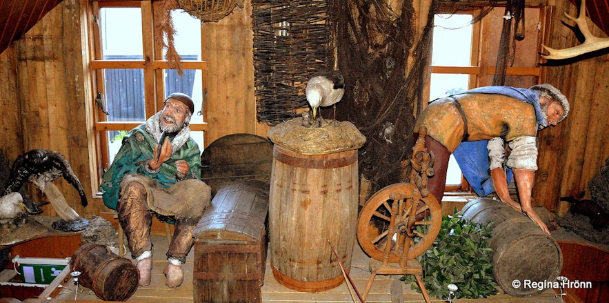 Interior decoration at the Fjorugardurinn restaurant, with models of Vikings at work.