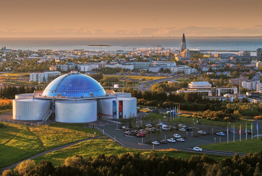 Perlan at sunset with Reykjavik in the background