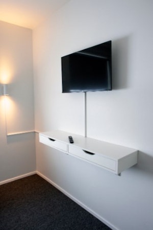 The private rooms at Eidar Hostel & Apartments all come with flat-screen TVs.