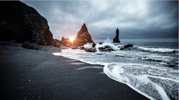 The dramatic black sands of the Reynisfjara beach on the South Coast of Iceland.