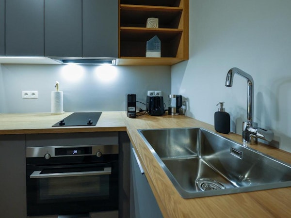 A kitchen area with an oven and stove at Center Apartments in Reykjavik.