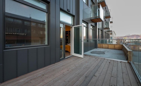 An open door leading to a large balcony at Center Apartments in Reykjavik.
