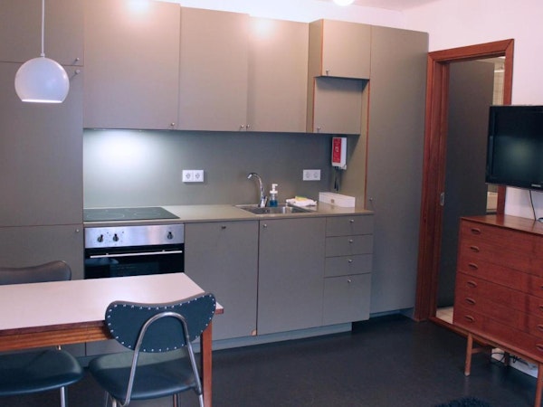 The kitchen area and dining table at one of the Astro Apartments in central Reykjavik.