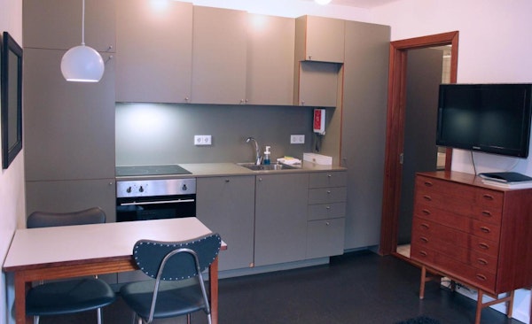 The kitchen area and dining table at one of the Astro Apartments in central Reykjavik.