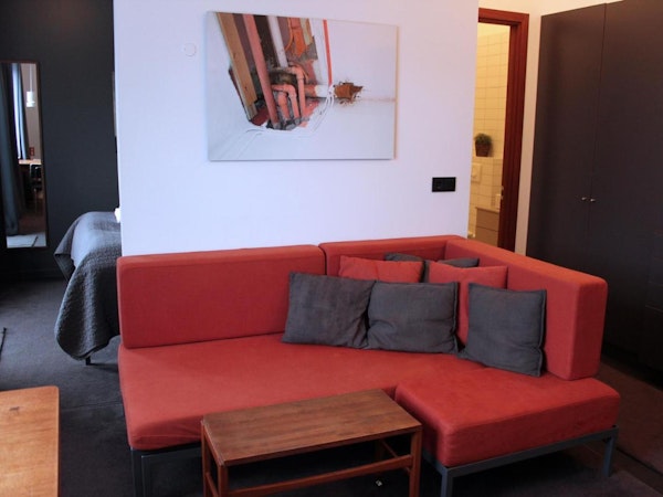 A comfortable sofa with cushions at Astro Apartments in central Reykjavik.