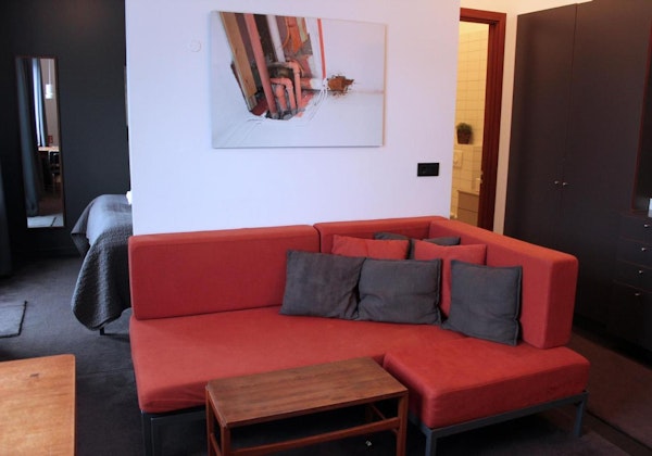 A comfortable sofa with cushions at Astro Apartments in central Reykjavik.
