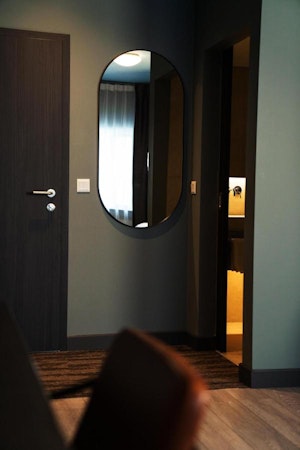 A door and mirror at Konvin Hotel near Keflavik Airport.