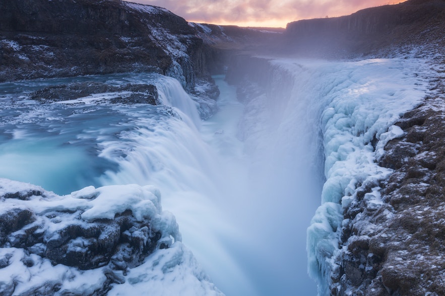 Gullfoss in winter surrounded by frozen cliffs, part of the Golden Circle in winter