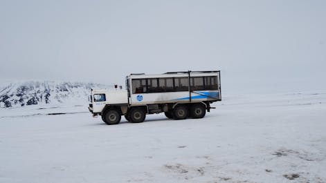 A monster truck drives on the Langjokull Glacier in Iceland.