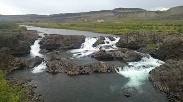 A river in West Iceland with small waterfalls along it.