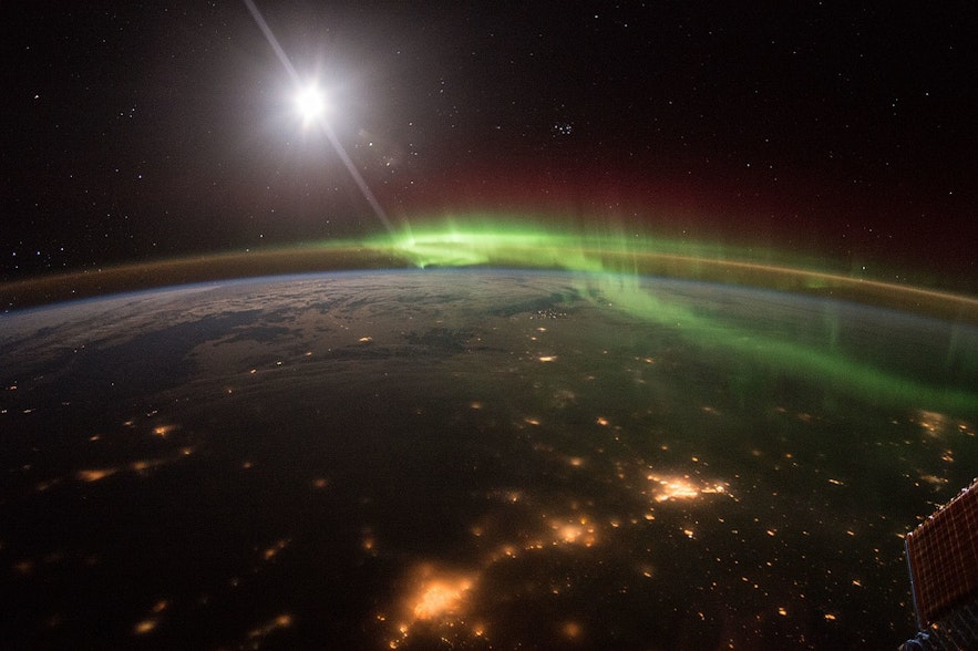Photograph showing aurora borealis hitting the earth from the ISS international space station